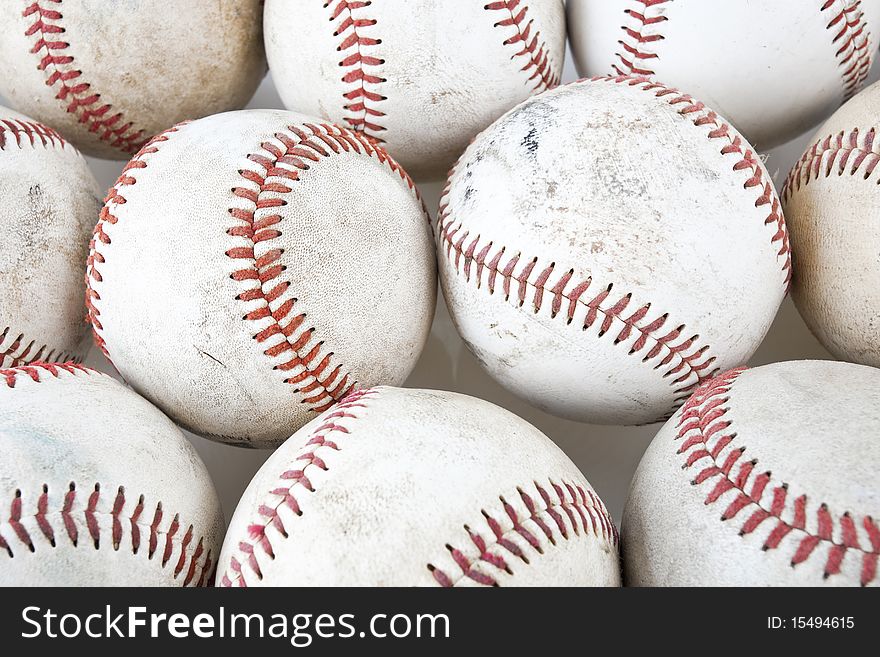 Close up of old baseballs on white background. Close up of old baseballs on white background.
