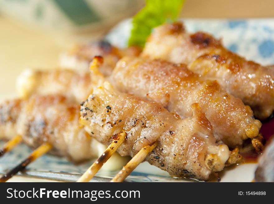 Delicious skewered chicken barbecued and ready to be served.