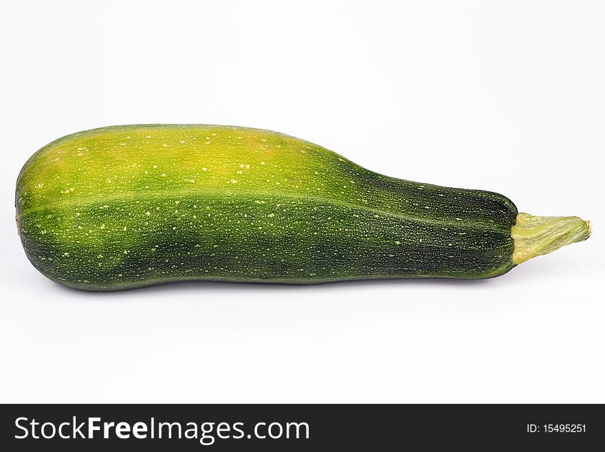 Ripe vegetable marrow on a white background