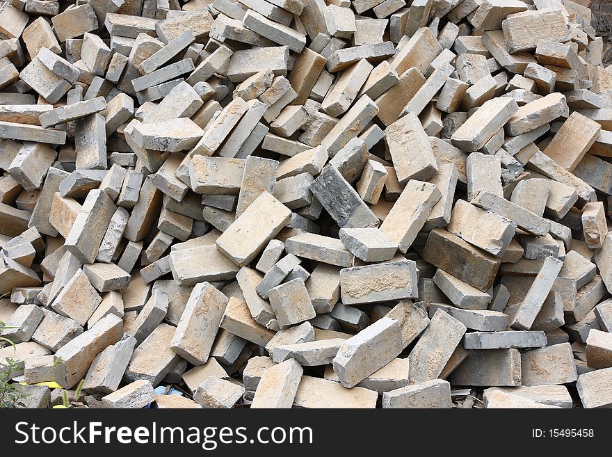 Pile of gray bricks at site of street repair