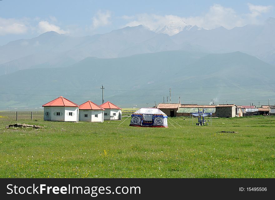 Grasslands of northern China. Mongolian build  yurts on the  grasslands. Grasslands of northern China. Mongolian build  yurts on the  grasslands.