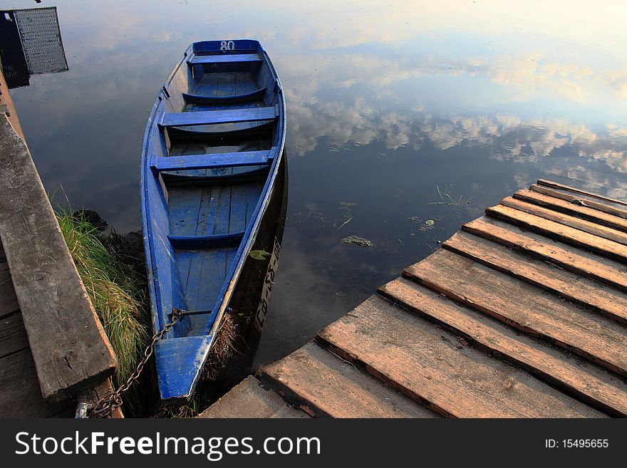 Boat at a mooring of beautiful lake