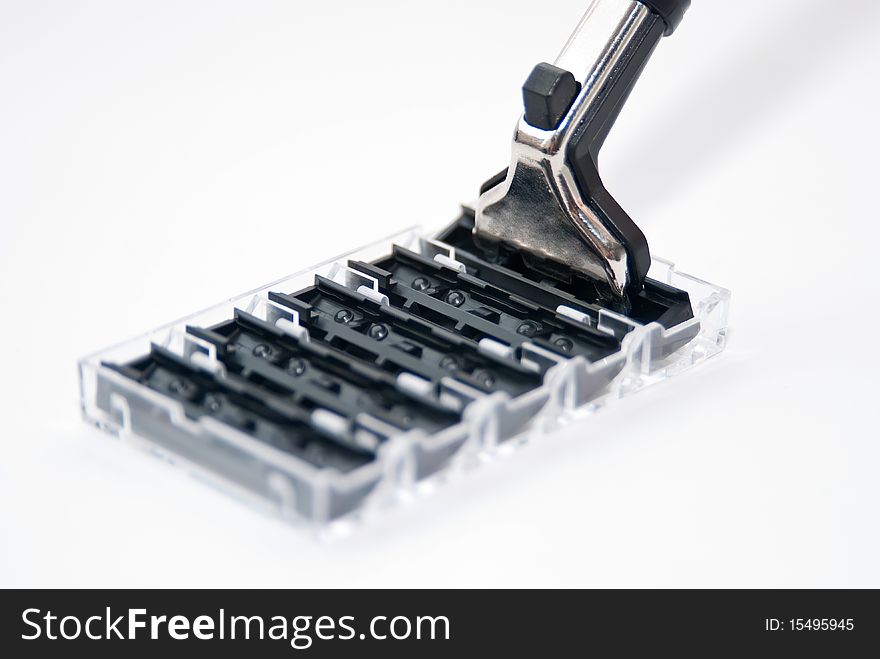 Razor and  blades isolated on a white background.