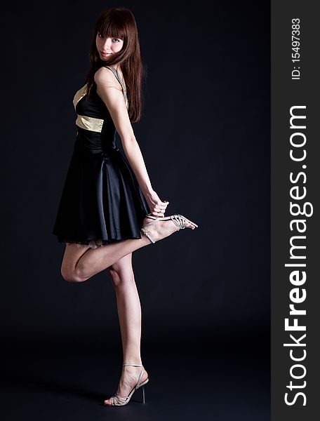 Beautiful teenage girl on black background