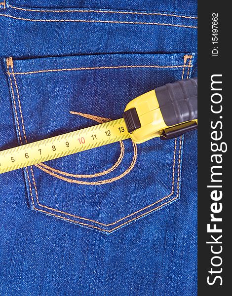 A pocket of blue jeans and measure. A pocket of blue jeans and measure