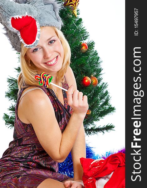 Girl near Christmas fir tree. Isolated on white