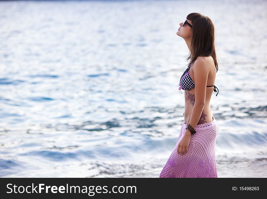 Young beautiful woman wearing fashionable stuff on the beach. Young beautiful woman wearing fashionable stuff on the beach