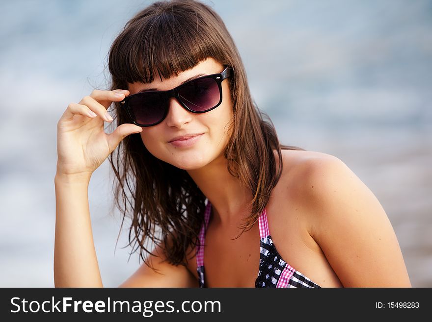 Glamor portrait of a young pretty woman wearing swimsuit. Glamor portrait of a young pretty woman wearing swimsuit.