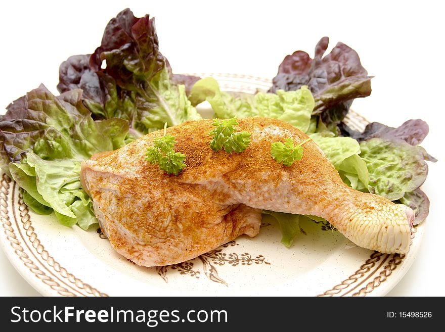 Raw chickens thighs seasoned with salad