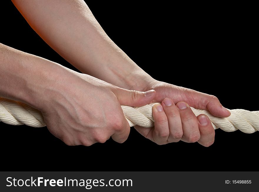 Tight the rope with two hands macro shot isolated over black background