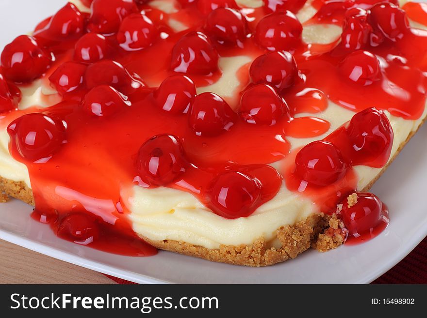 Closeup of a cheesecake topped with cherries. Closeup of a cheesecake topped with cherries