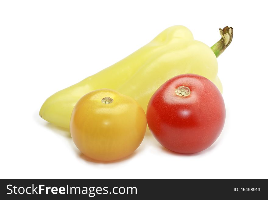 Fresh ripe paprica, red and yellow cocktail tomatoes isolated on white