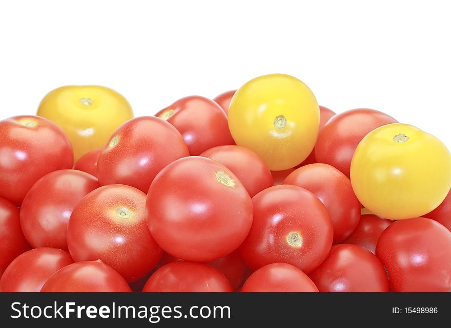 Red and yellow cocktail tomatoes isolated on white