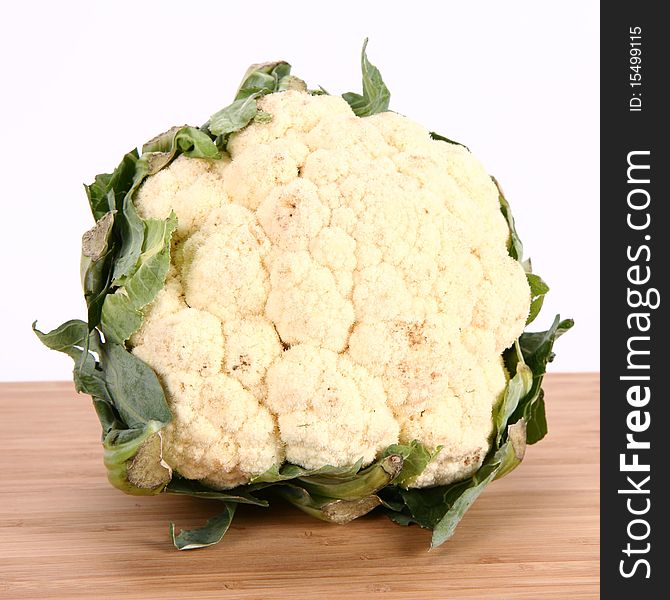 A Cauliflower on wooden board