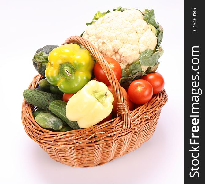 Basket full of vegetables on white background. Basket full of vegetables on white background