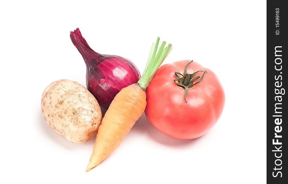 Collection of vegetables: potatoes, tomatoes, onion, cucumber, carrots were taken on a white background