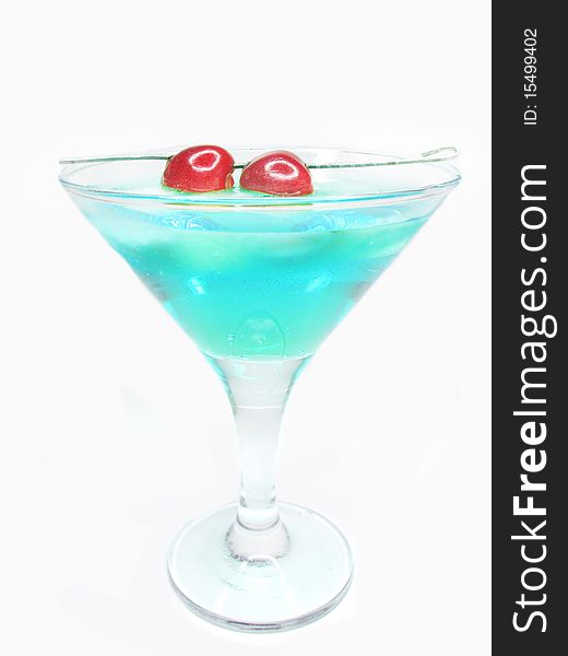 Alcohol blue liqueur cocktail with ice and cherry. Alcohol blue liqueur cocktail with ice and cherry