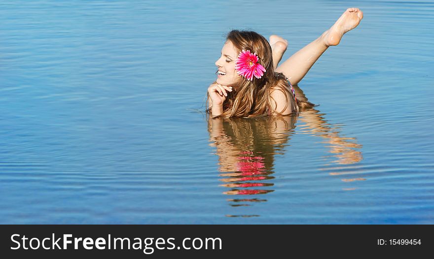 Young attractive woman in water