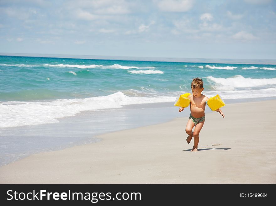 Boy Running On Beach