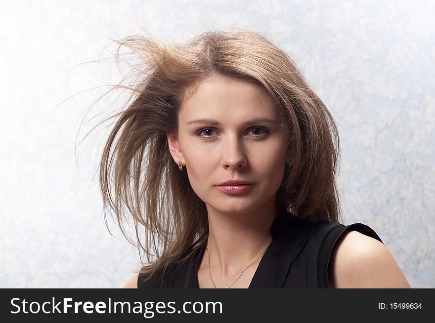 Young woman with makeup over light defocused background. Young woman with makeup over light defocused background