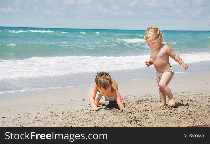 Two kids playing on beach