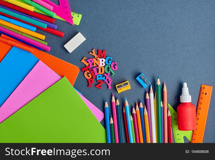 School supplies frame on a dark background