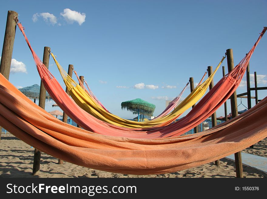 Colorful hammocks on a beach