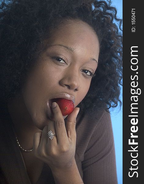 Pretty Girl Eating A Strawberry