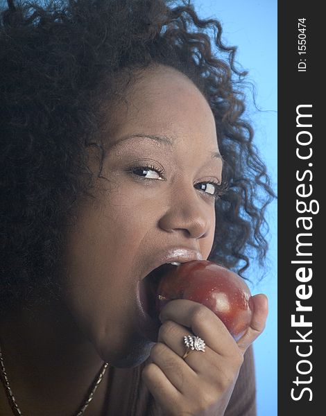 Close up of a girl eating an apple