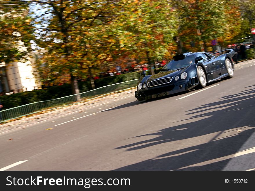 Black speed race roadster on the road. Black speed race roadster on the road