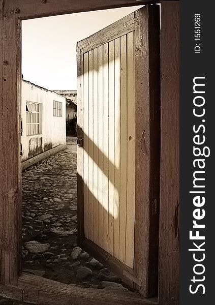 An old rural door with washed out colors. An old rural door with washed out colors