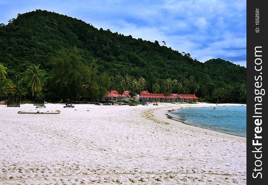 Redang beach view with white sandy beach, tropical trees & blue sea. Redang beach view with white sandy beach, tropical trees & blue sea.