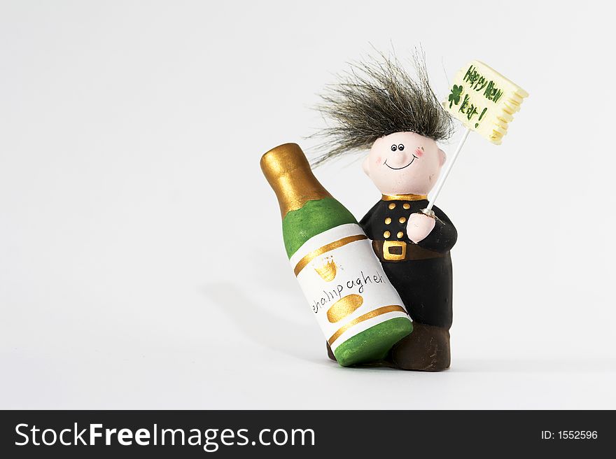 Chimney sweeper with Happy New Year sign and Champagne bottle in his hand