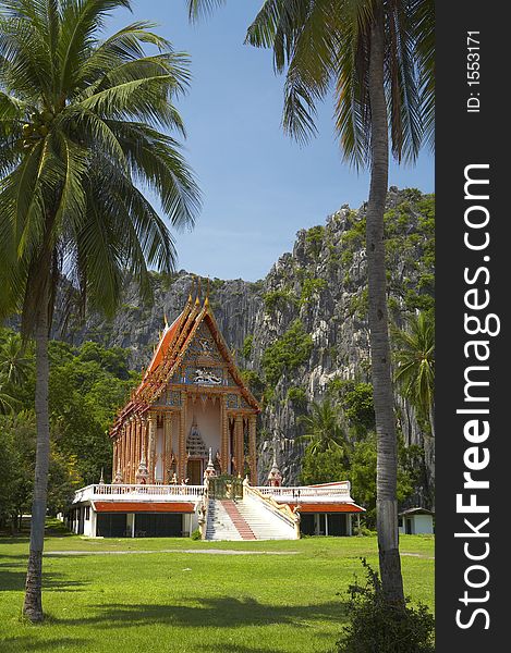 Buddhist shrine complex surrounded by rocks and palms. Buddhist shrine complex surrounded by rocks and palms