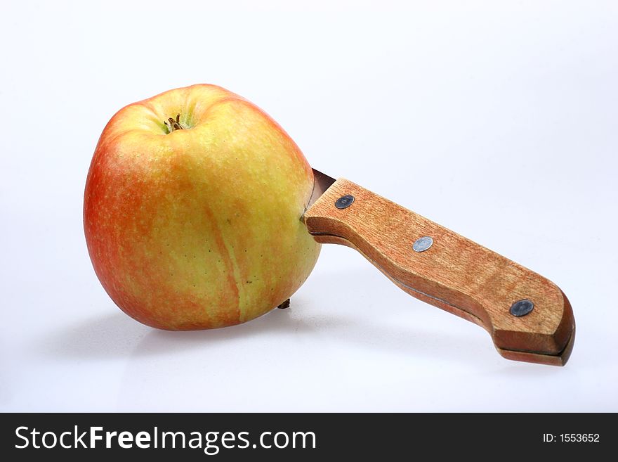 Red apple and knife isolated on white