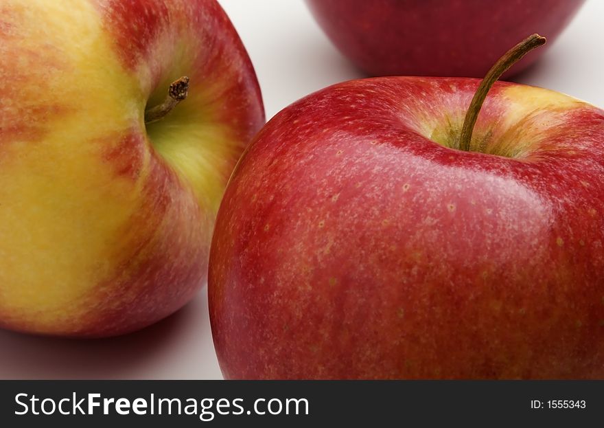 Close-up detail of several pinata apples on a white background. Close-up detail of several pinata apples on a white background.