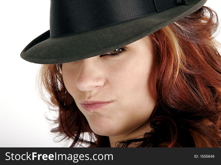 Pretty young woman in a man's hat. Pretty young woman in a man's hat