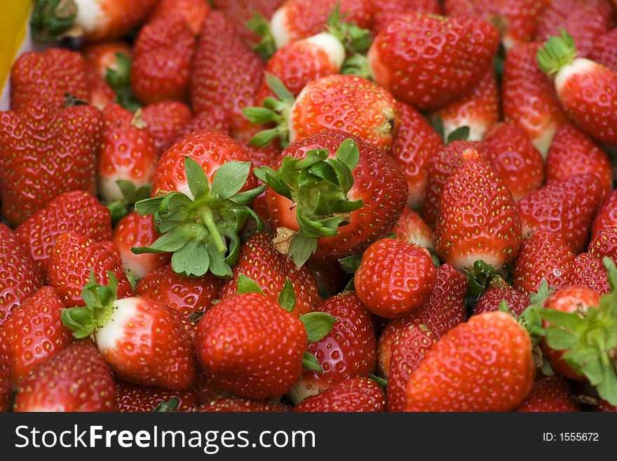 A stack of fresh strawberries from the farm.