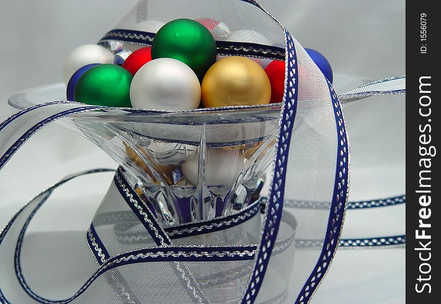 Various colored Xmas ornaments with silver and blue ribbons. Various colored Xmas ornaments with silver and blue ribbons.