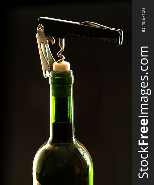 Wine bottle with cork screw. Wine bottle with cork screw