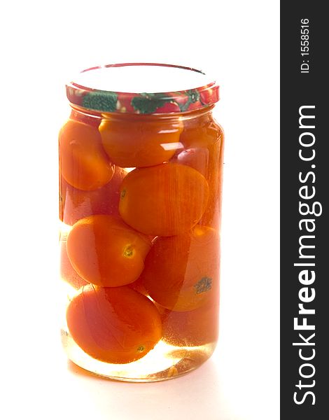 With a capacity of one the liter jar with tomatoes on a white background