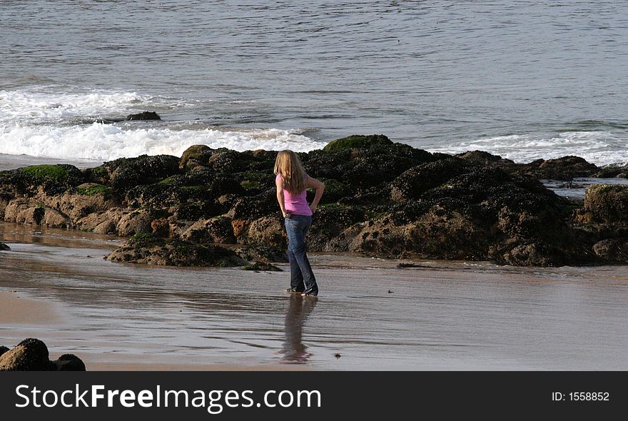 Girl on the beach at Monterey, California