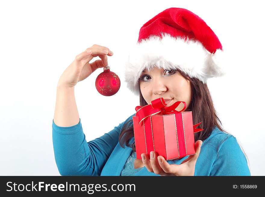 Attractive woman with santa claus hat and gift on white background. Attractive woman with santa claus hat and gift on white background