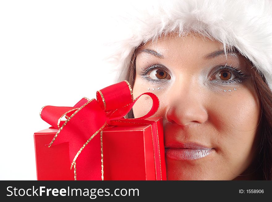 Attractive woman with santa claus hat and gift on white background. Attractive woman with santa claus hat and gift on white background