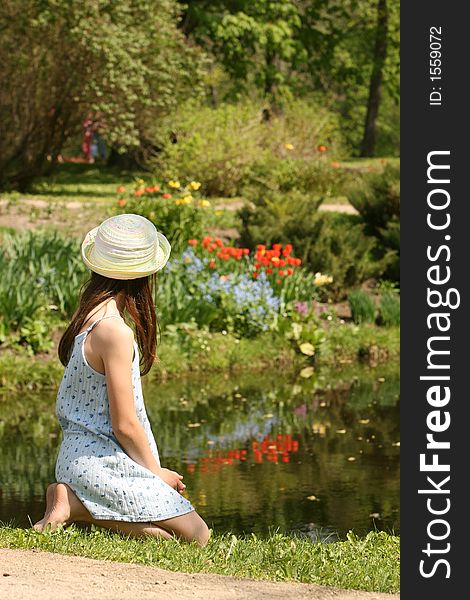 The girl with hat in the park of manor house. The girl with hat in the park of manor house