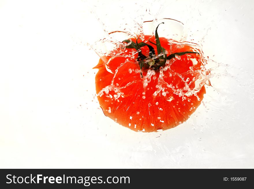 Tomato splashing in water