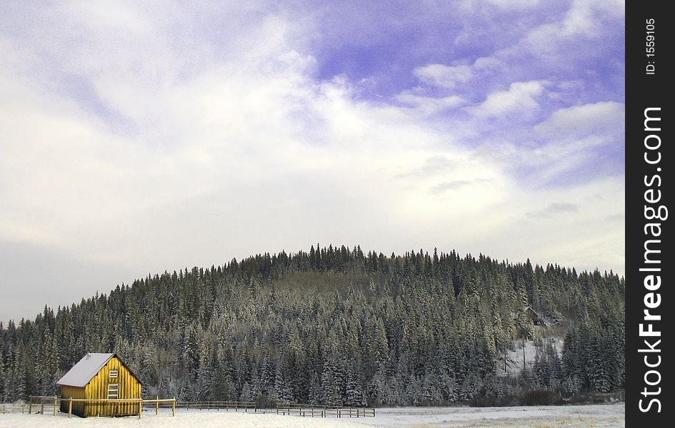 A small cabin in the snowy foothills of the Rocky Mountains. A small cabin in the snowy foothills of the Rocky Mountains.