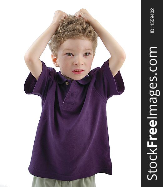 Toddler pulling his hair with violet shirt