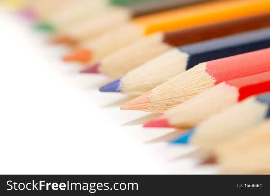 Lots of colorful crayons on a white background