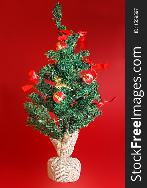 Christmas tree in a bright red background. Christmas tree in a bright red background